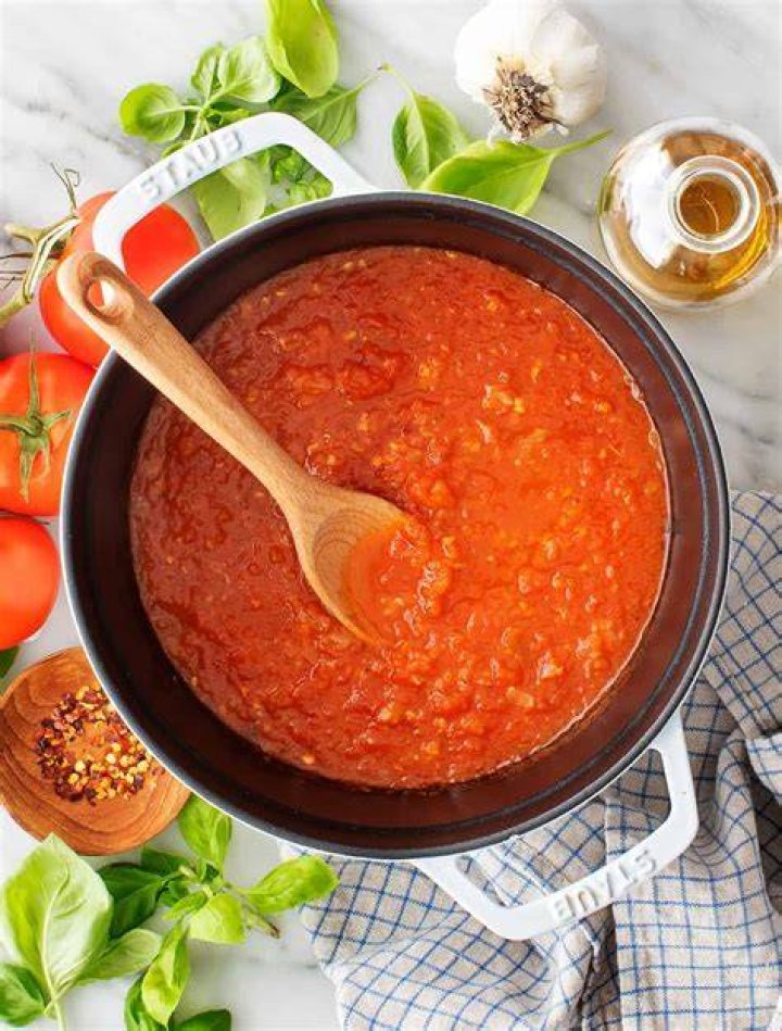 How do you make tomato sauce less bright?