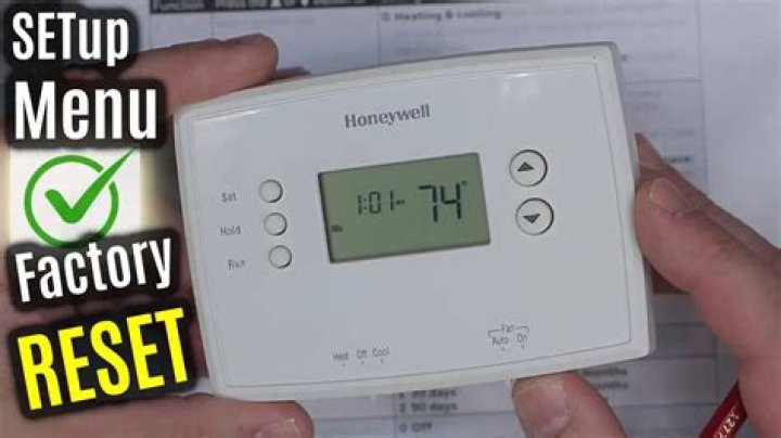How do you reset a hardwired thermostat?