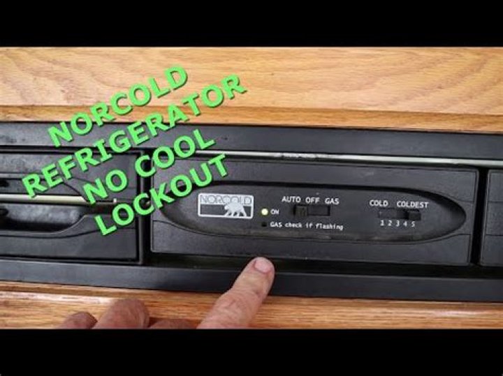 How do you reset a Norcold refrigerator control board?