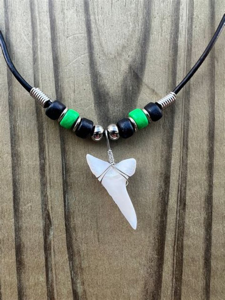 What do shark tooth necklaces mean
