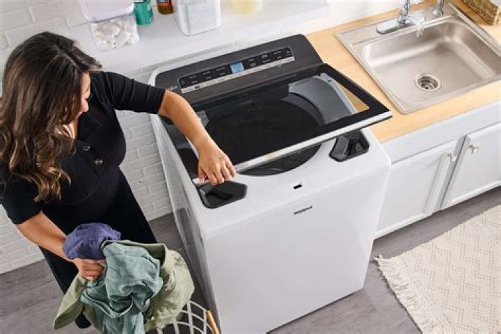 Where is the start switch on a top loader washer?